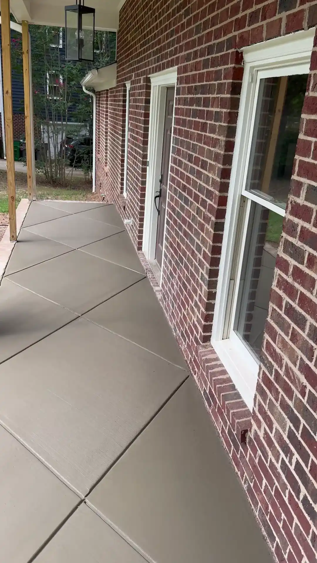Front porch slab with diagonal joints along a brick house in Charlotte