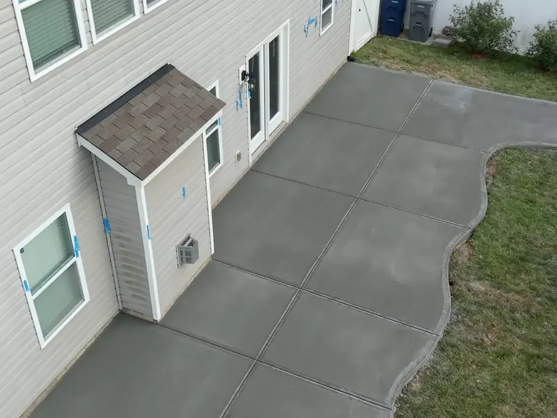 Overhead view of a curved backyard concrete patio in Harrisburg